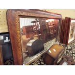 A Victorian cross banded and chequered strung over mantle mirror with ceramic bun feet