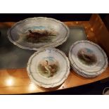 Twelve Carl Thelsch decorative plates with game bird design and a matching large platter all with