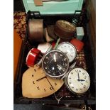 A box of vintage clocks