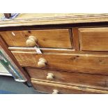 A Victorian pine chest of two short over three long graduated chamfered drawers each with turned