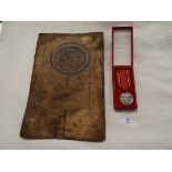 A Polish War medal 'Ministers Two Obrony Narodowej' and two Indian parchments both with seals and