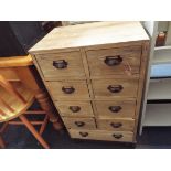 An iron bound shot blasted pine nine drawer chest each fitted with cup handles