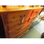 A pine chest of four short and four long graduating drawers