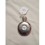 An early 20thC sterling silver half hunter pocket watch with enamel dial and Roman numerals,