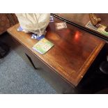 A mahogany side table with boxwood and shell inlay having hinged flap dummy drawers resting on