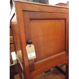An early 20thC mahogany pot cupboard raised on slender chamfered supports