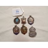 A mixed selection of silver medallion fobs including ballet and a silver A.R.P.