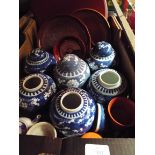A selection of oriental ware to include lacquered trays and pot, ginger jars,