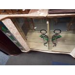 A 1950's Formica drinks cabinet/bar with mirror back and floral decorated glazed panels