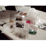 A box of costume jewellery to include necklaces, rings, earrings etc.