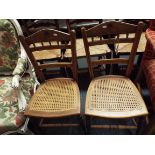 A pair of Edwardian spindle back bedroom chairs with bergere seat