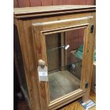 A pine and glass display cabinet
