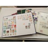 Three albums of assorted stamps and a blank album