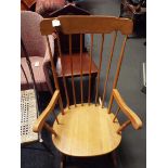 A beech spindle back rocking chair