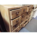 A shot blasted shabby chic chest of 20 drawers with cup handles