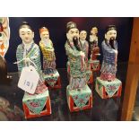 Seven ceramic figures from the eight immortals to include Ho Hsien-Ku, Li Treh Kuai,
