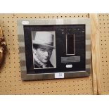 A framed limited edition photograph and film cell strip from the John Wayne film 'The War Wagon',