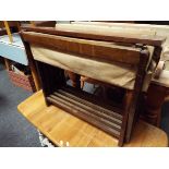 A mid 20thC mahogany framed camping bed