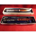 A boxed Viners silver handled cheese knife together with a boxed silver handled grapefruit knife