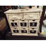 A painted shabby chic six drawer spice chest with drawers above