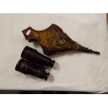 A small pair of hand painted bellows and a pair of binoculars