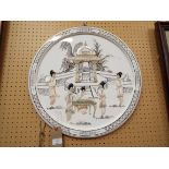 An Oriental circular wall plaque in white with hand painted pagoda and garden scene,