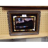 A 20thC butterfly wing picture with silhouette of a Rio landscape set in a frame