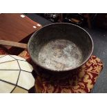 An antique copper saucepan