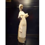 A Nao figurine of a 'Female Water Carrier'