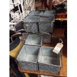 Three galvanised wire-work four section plant pot holders with swing handles