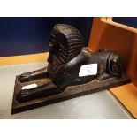 A doorstop in the form of a sphinx