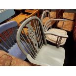 Three painted kitchen chairs to include a wheel and stick back carver chair