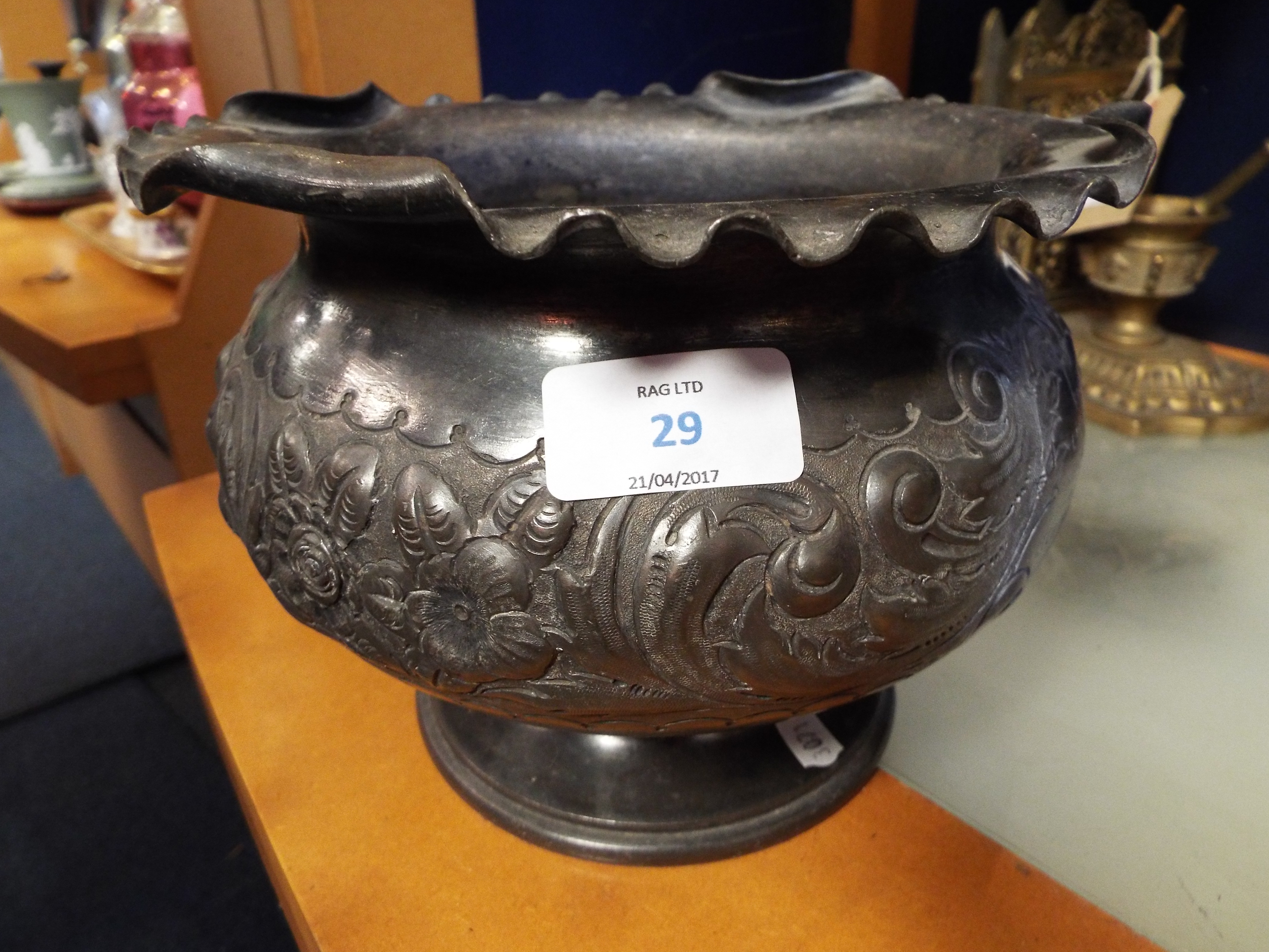 An Edwardian pewter jardiniere embossed with floral scrolls inscribed from LT Colonel and Mrs