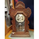 An American Ansonia carved gingerbread clock