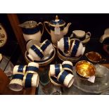 A mid-20thC Crown Devon gilt coffee and tea set with blue banding