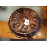 A Victorian copper and brass chocolate mould of mainly of shells and flowers