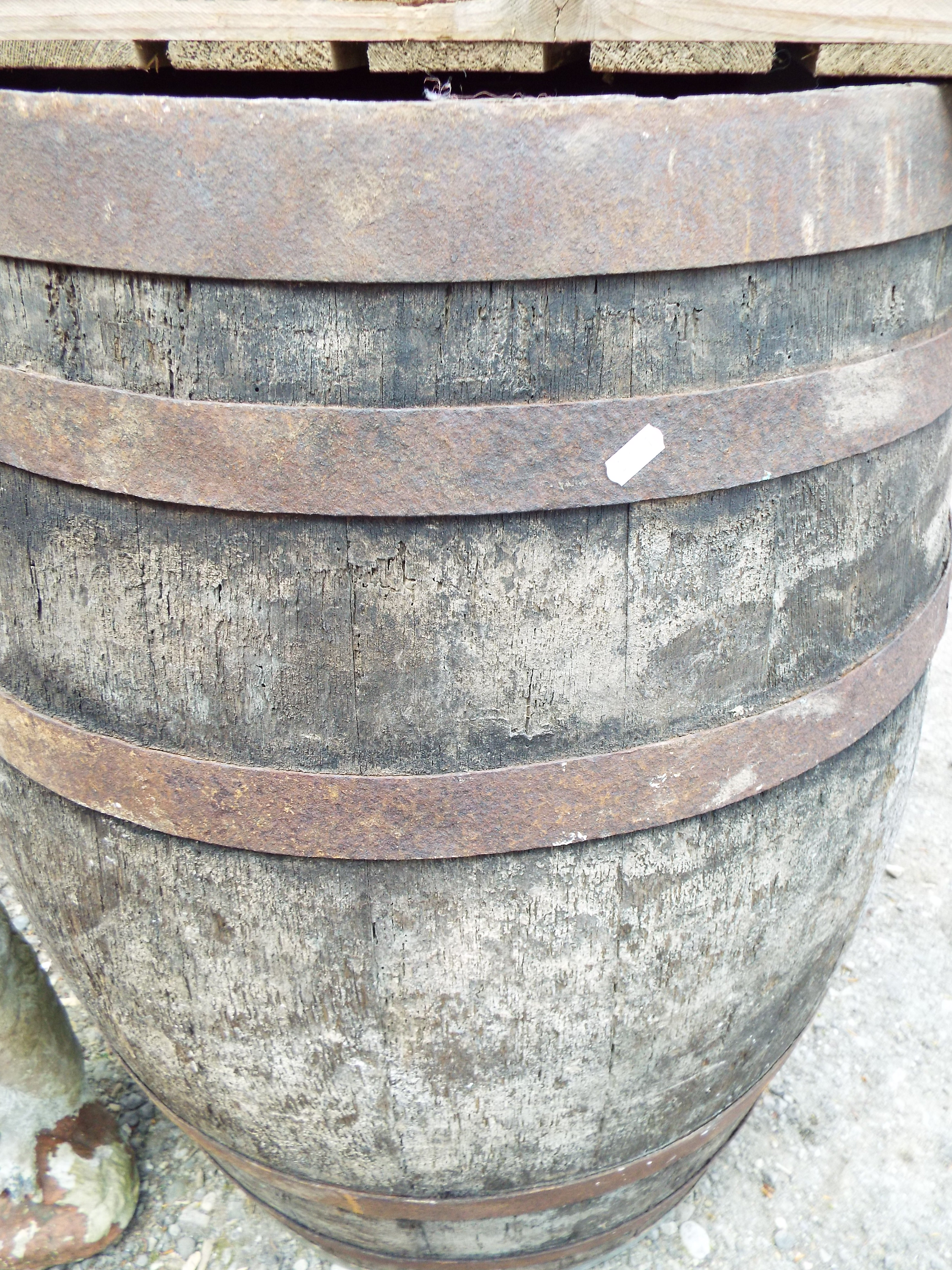 A large wooden and metal banded barrel