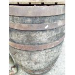 A large wooden and metal banded barrel