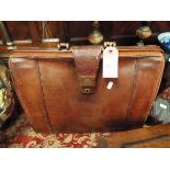 A vintage brown leather attache case 17" wide x 13.