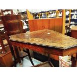 An early Victorian rosewood and satinwood strung inlaid corner table with under-tier