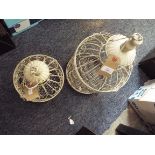 Two cream painted wire-work bird cages