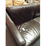 A brown leather two seater sofa