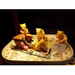 Three Royal Doulton 'Pooh Bear' figurines,