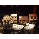 A collection of O'Donoghue Rye pottery money boxes and miniature houses,