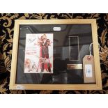 A framed postcard and film cell strip from the James Bond film 'Octopussy',