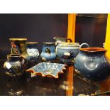 A selection of Torquay pottery to include blue glazed milk jug, kingfisher vase, butterfly jug etc.