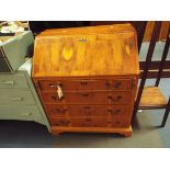 A yew-wood bureau with double fining drawers