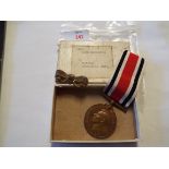 A Lincolnshire Special Constabulary medal to Walter Spooncer Jnr and ribbon badge