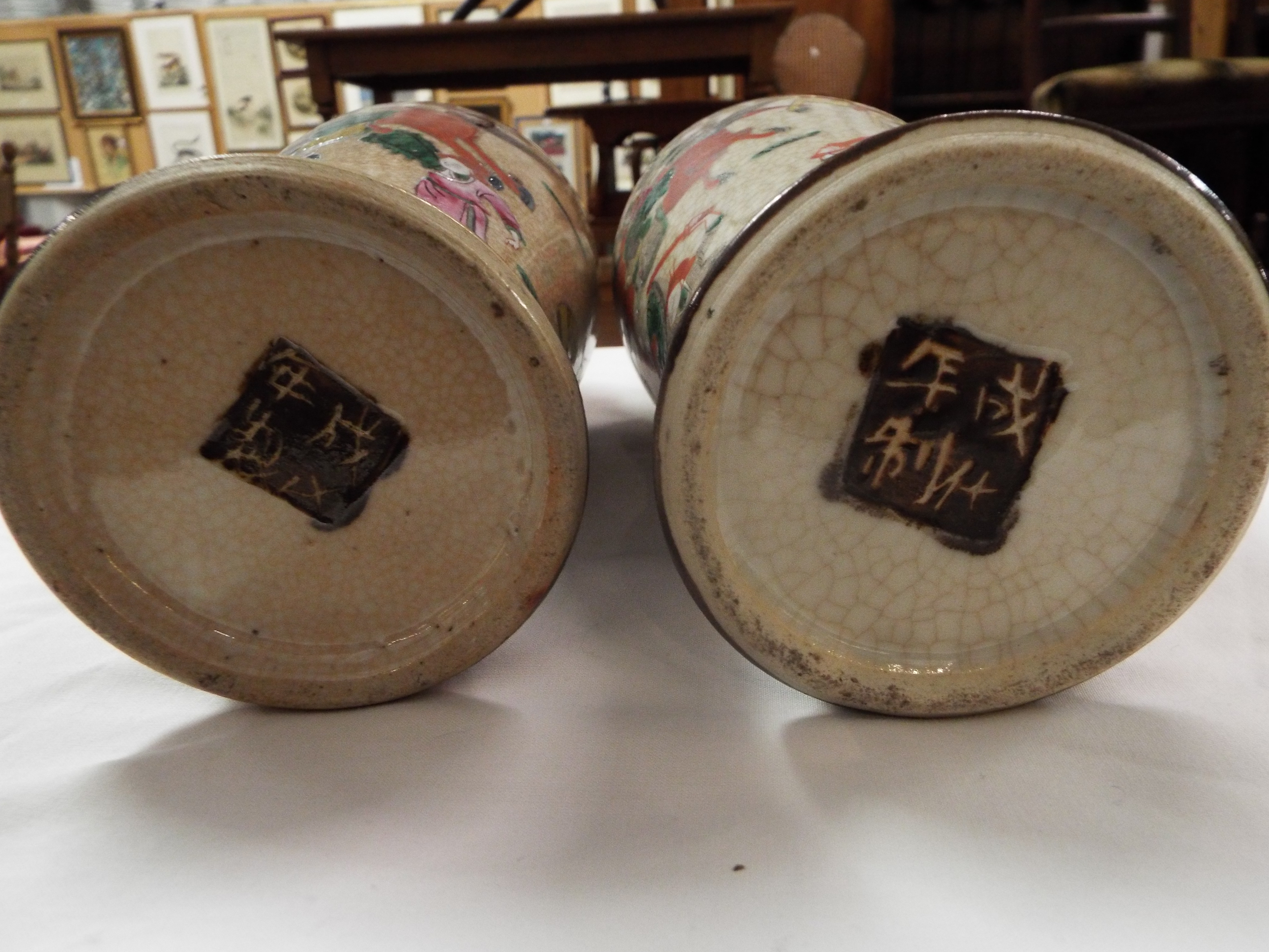 A pair of early 20thC crackle glazed Japanese vases of baluster form enamelled with battling - Image 5 of 7