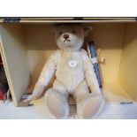 A boxed Steiff limited edition 709 of 4000 'Teddy Bear 1921' in white mohair complete with tag and